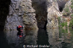 Cave diver at the surface in the cavern section of a floo... by Michael Grebler 